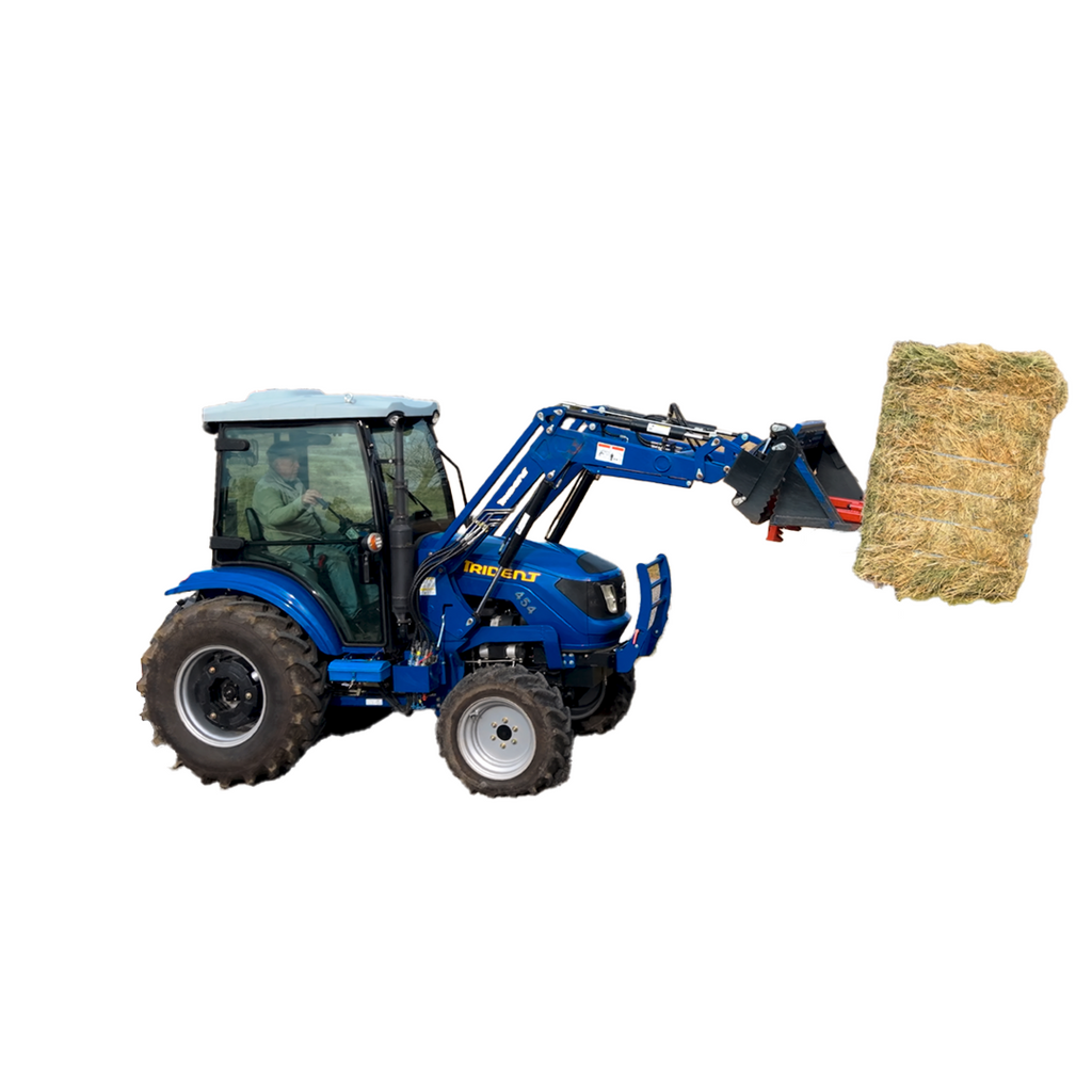 BucketMate in a 4-in-1 bucket with hay spears attached, lifting a square bale